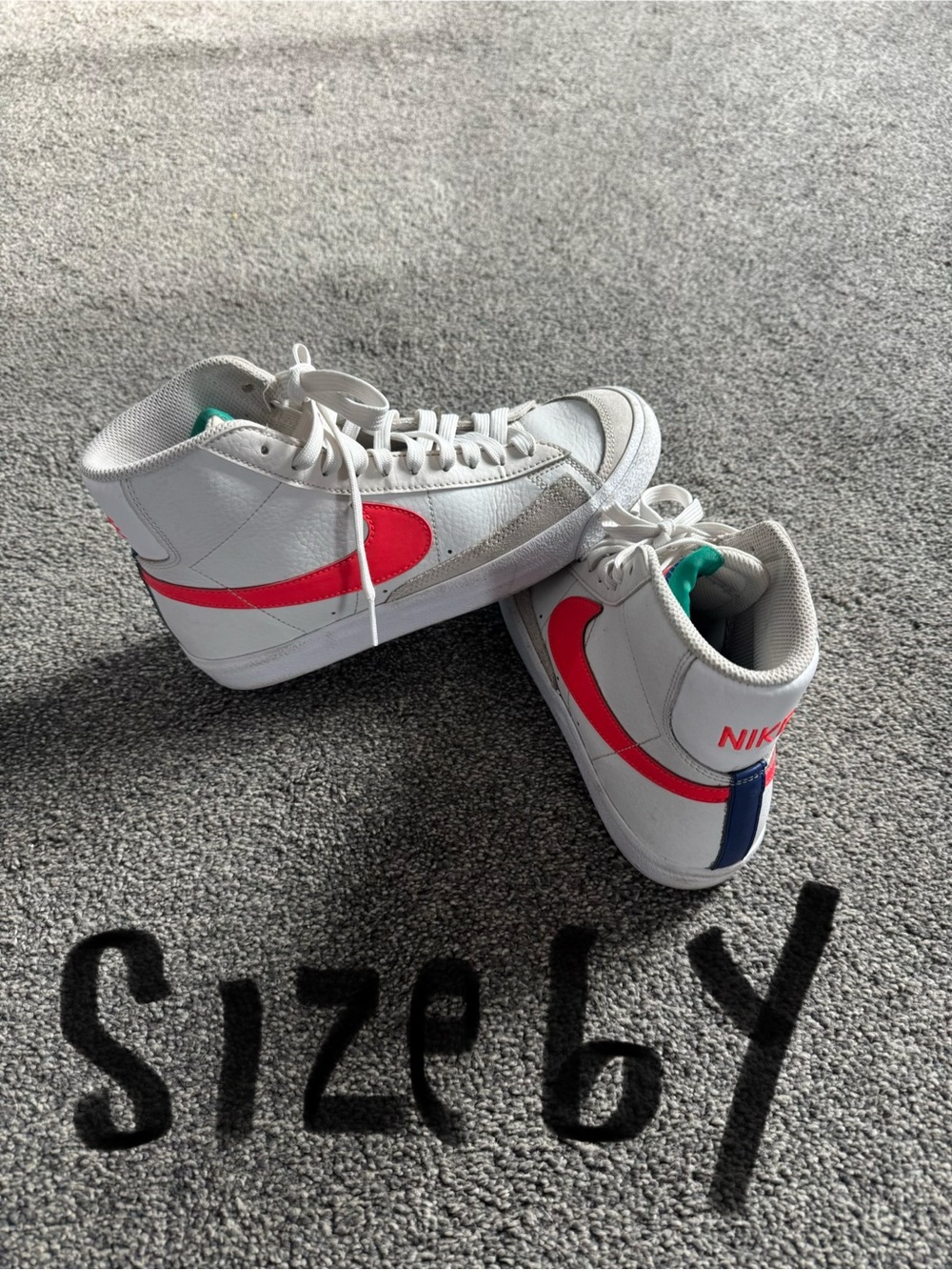 Nike Kids White High-Top Sneakers with Orange Swoosh